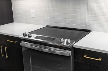 A stove top oven sitting inside of a kitchen